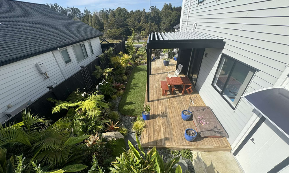 Deck beside landscaped garden