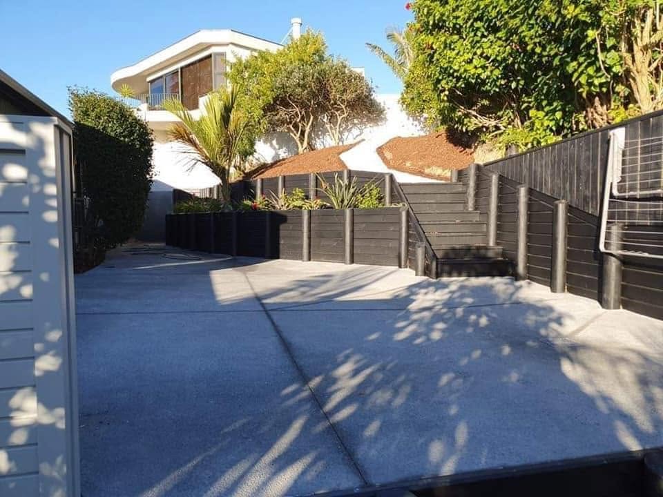 Completed retaining wall and concrete landscaping project