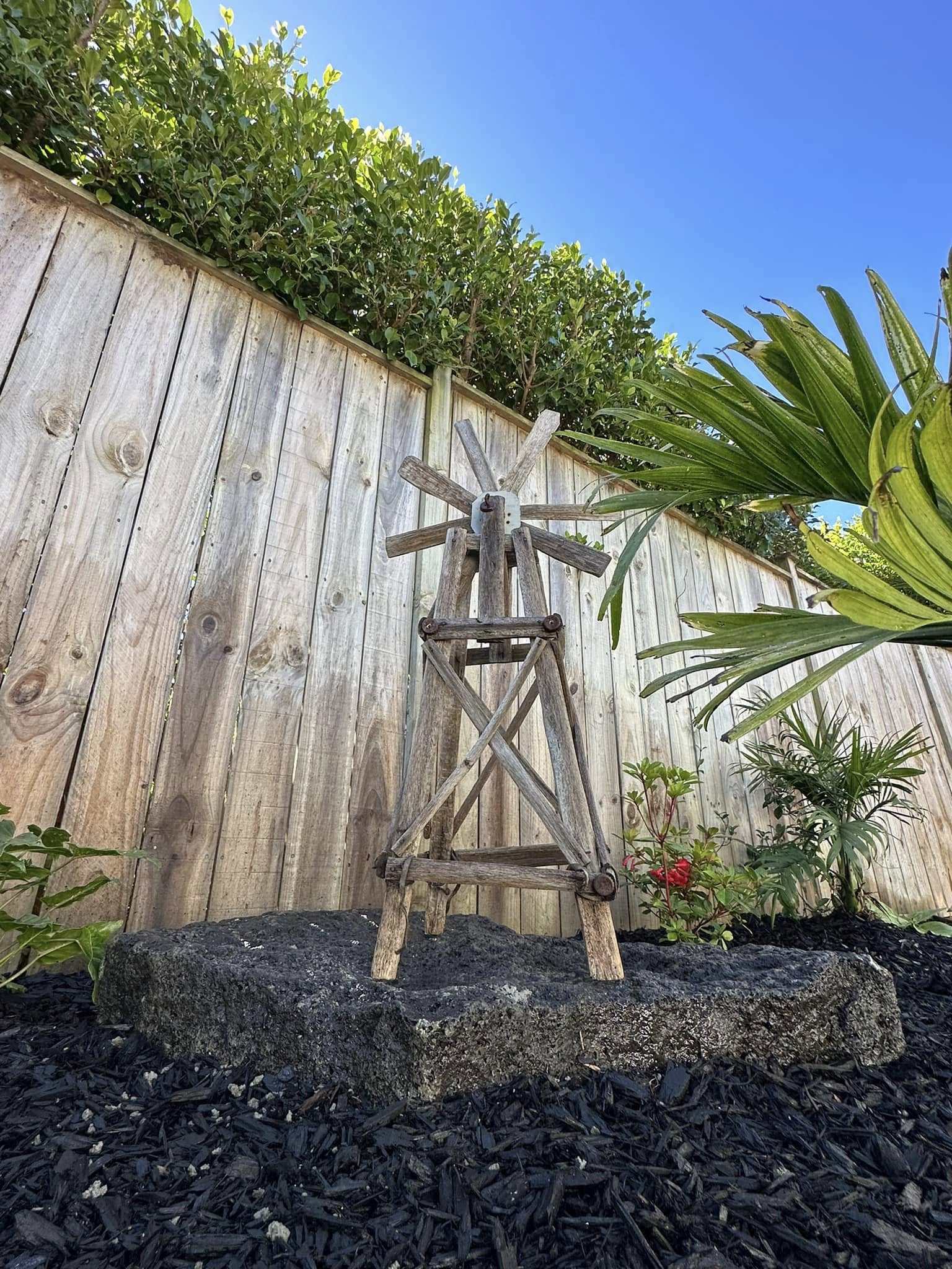 Rustic timber windmill garden feature