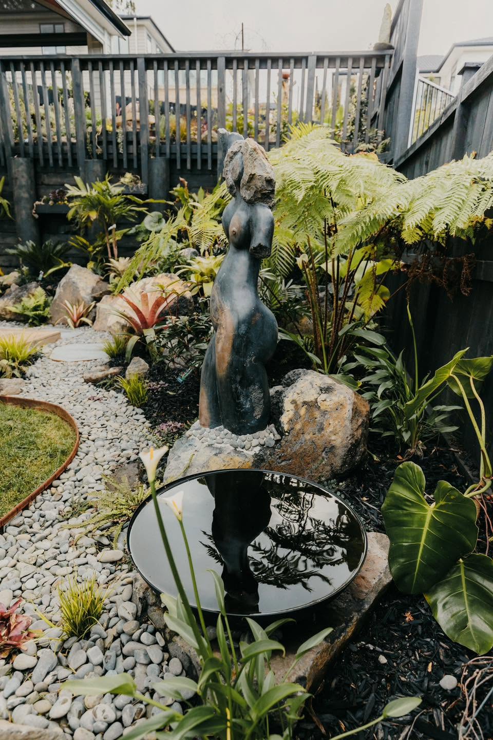 Garden statue and reflective water feature